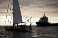 The sailing vessel Tiama in front of the drill support vessel the Hart Tide. The Oil Free Otago flotilla is a coalition of Otago residents who oppose deep sea drilling off our coast. Photo by Nick Tapp - nicktappvideo.com